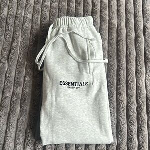 Light oak Essentials straight sweat pants, in a size small.